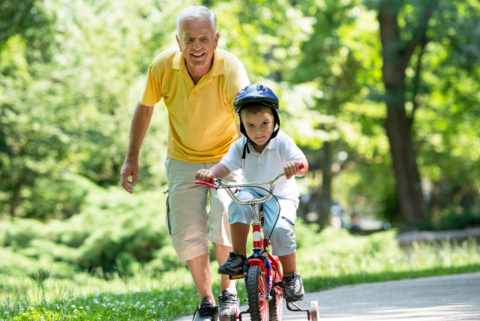 Kid learning how to ride a bike
